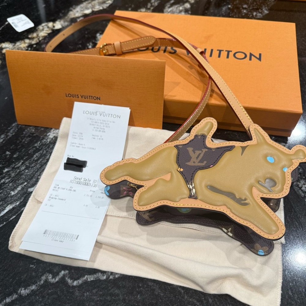 NEW! Louis Vuitton Craggy Dog on Strap. Comes with original receipt.